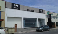 Fachada de concesionario Mazda en Ávila.<br> Revestimiento de fachadas. Fachada panel composite de aluminio