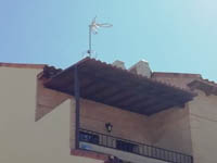 Vivienda en Torrijos (Toledo).<br> Cubrición de terraza. Panel sándwich imitación teja