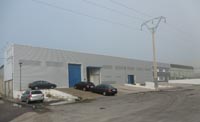 Almacén distribuidor en Seseña Nuevo (Toledo).<br>Revestimiento de fachadas.Fachada de chapa perfil Atenea y Euroline 300