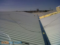 Cubierta sandwich in situ, Aislamiento y chapa grecada.<br>Nave industrial, Toledo