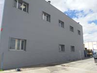 Nave industrial en Coslada (Madrid).<br>Revestimiento de fachadas. Fachada de chapa perfilada tipo minionda