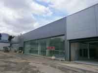 Fachada panel sandwich.<br>Concesionario Opel en Lisboa(Portugal)