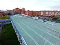 Piscina en Moreda (Gijón). <br>Reparación de cubierta. Chapa de acero prelacada